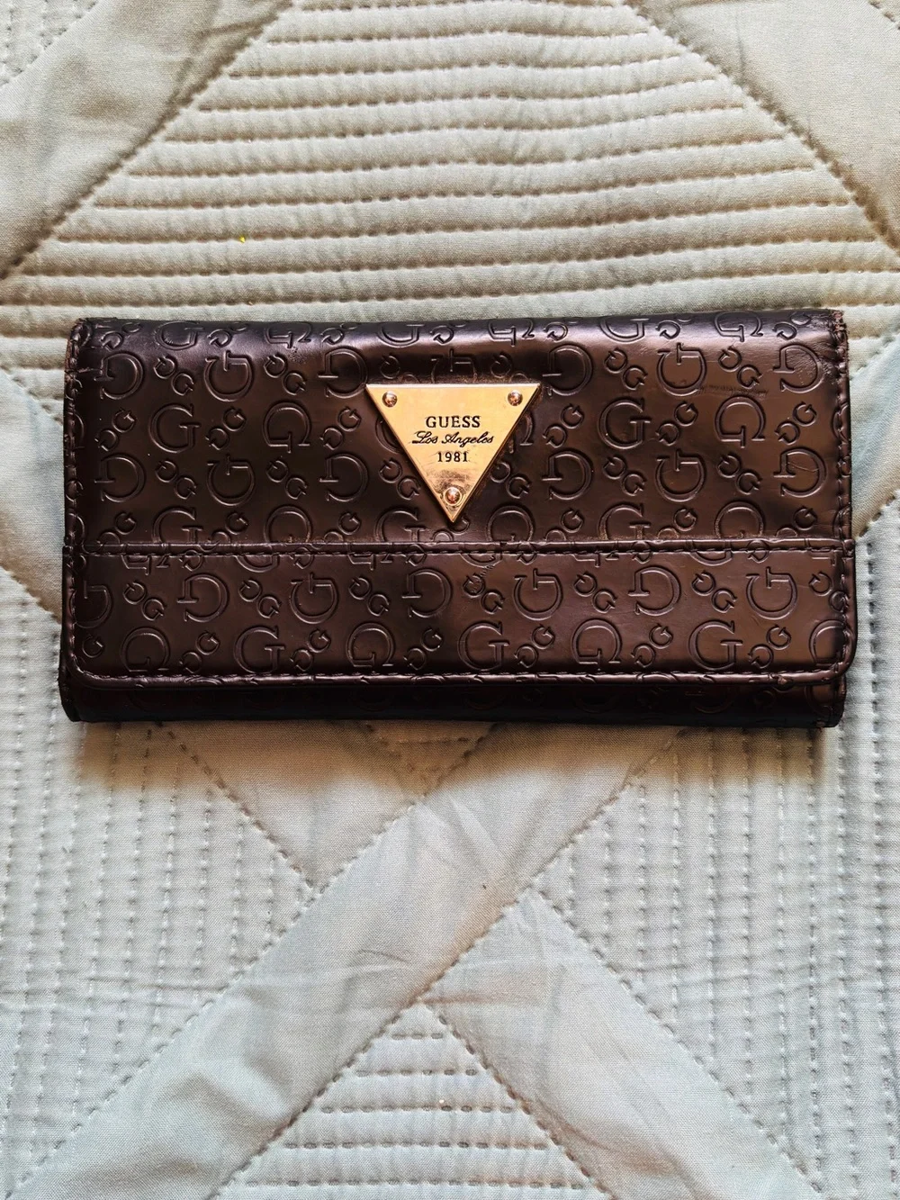 Guess black Embossed Logo Tri-Fold Wallet with Gold Triangle Plaque
